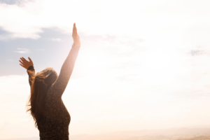 A woman with her arms in the air